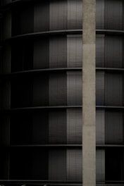 Modern aluminum exterior blinds installed on a sunny residential building.