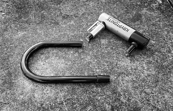 a black and white photo of a hair dryer laying on the ground