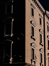 Close-up of a hotel facade with cinematic lighting emphasizing architectural details.