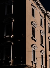 Close-up of a hotel facade with cinematic lighting emphasizing architectural details.