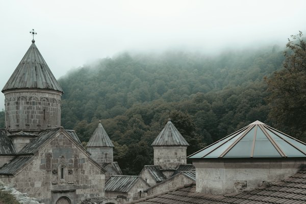 A church with a steeple and a steeple with a cross on it — Dilijan, Armenia