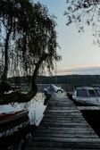 Private dock extending into the lake with a kayak tied up, ready for a peaceful paddle.