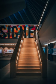 a staircase leading up to a sign in a building