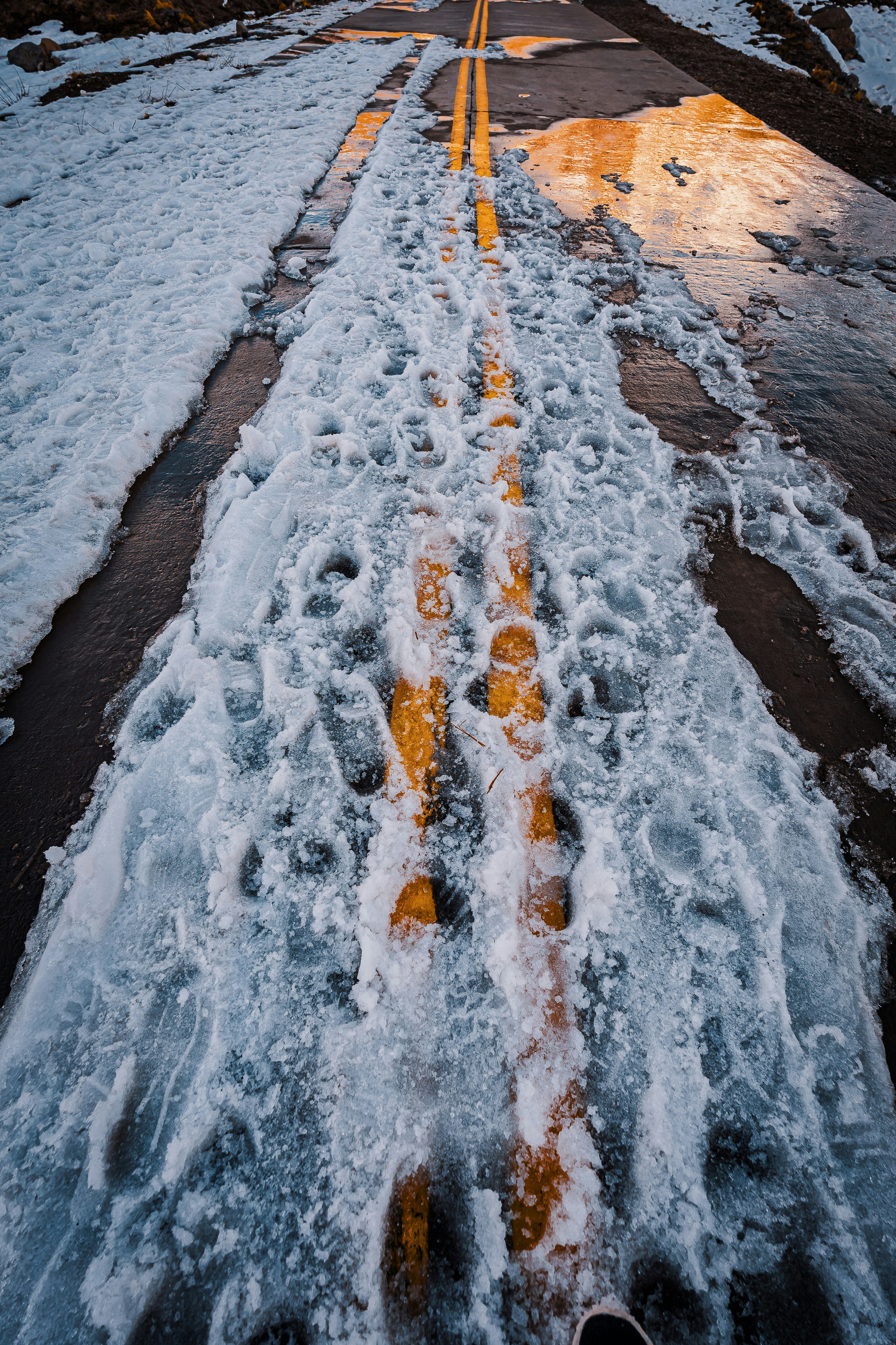 a road that has some snow on it