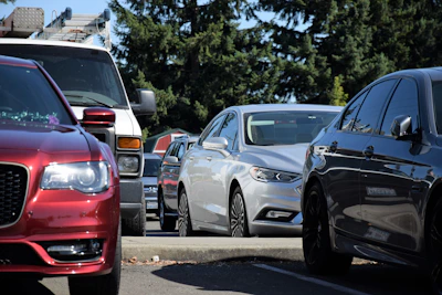 a row of parked cars on a city street