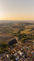 Aerial view of a peaceful land plot neighborhood near the sea in Šiauliai under a clear sky