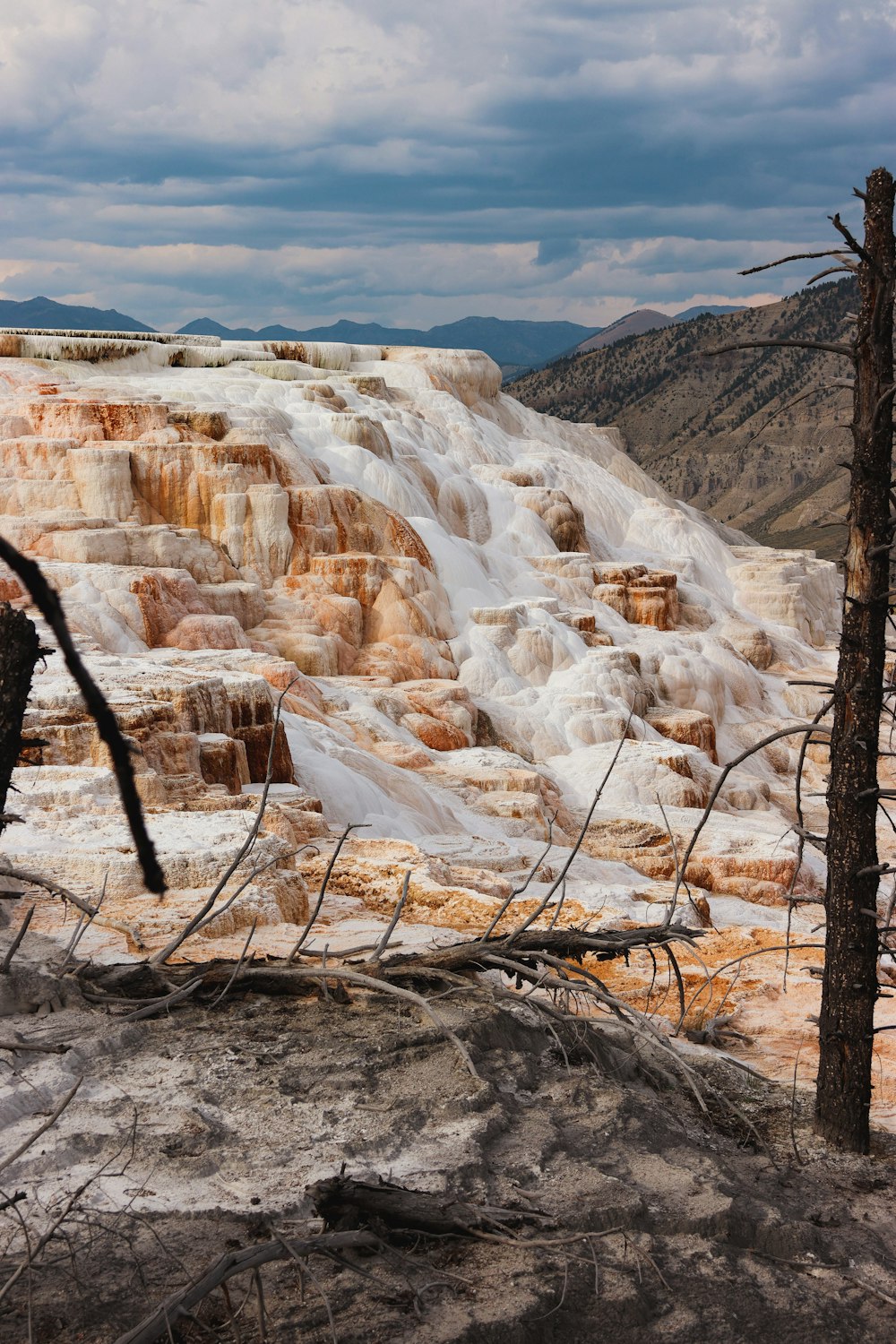 a view of a mountain with a waterfall in the background