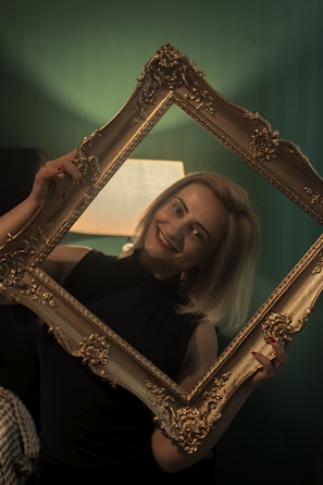 A customer holding a personalized poem plaque, smiling warmly.