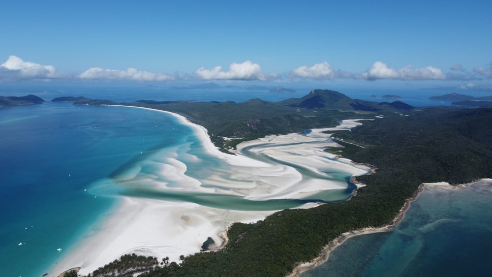 an aerial view of a white sand beach