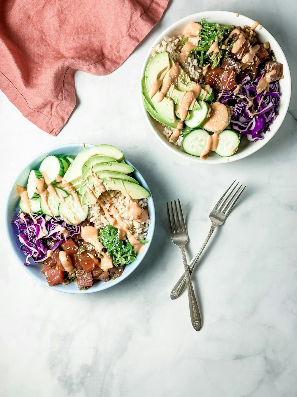 two bowls of food are sitting on a table