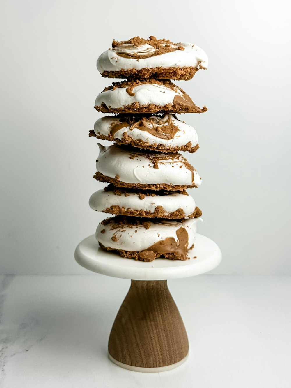 a stack of cookies with white frosting on top