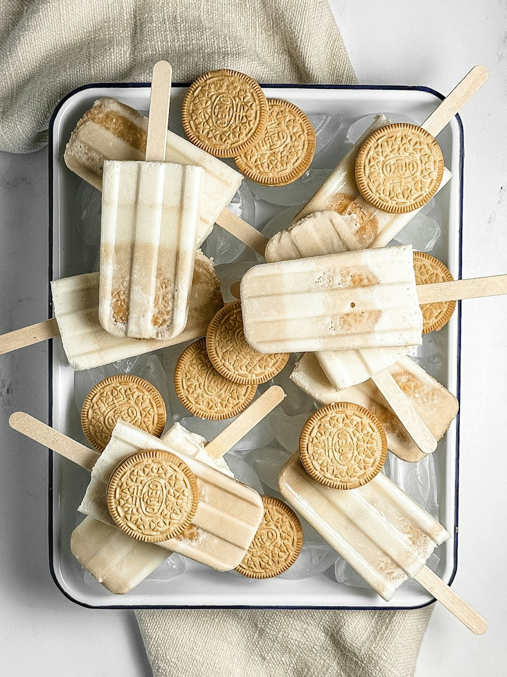 a tray of cookies and ice cream pops