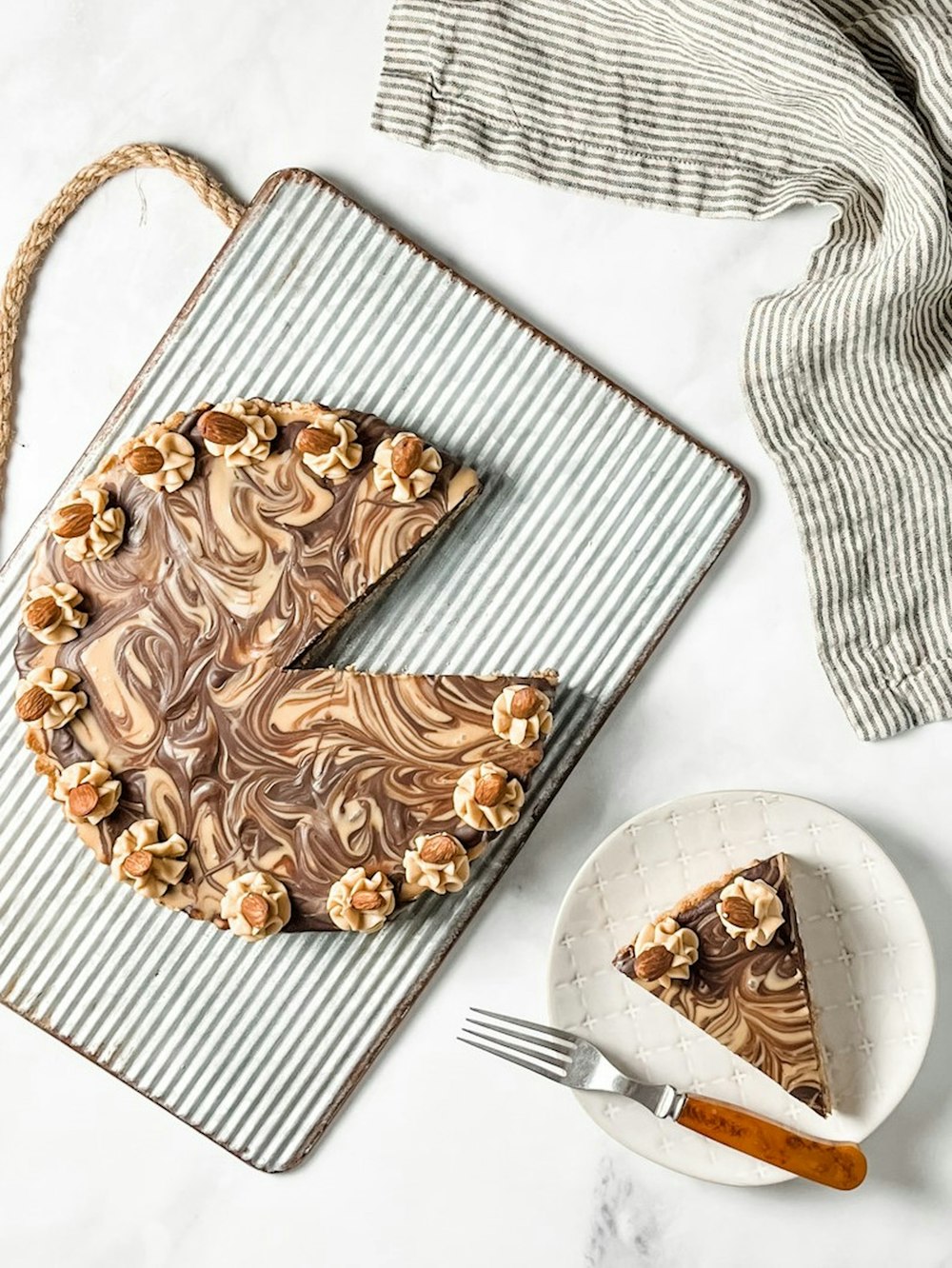 a piece of chocolate cake on a cooling rack