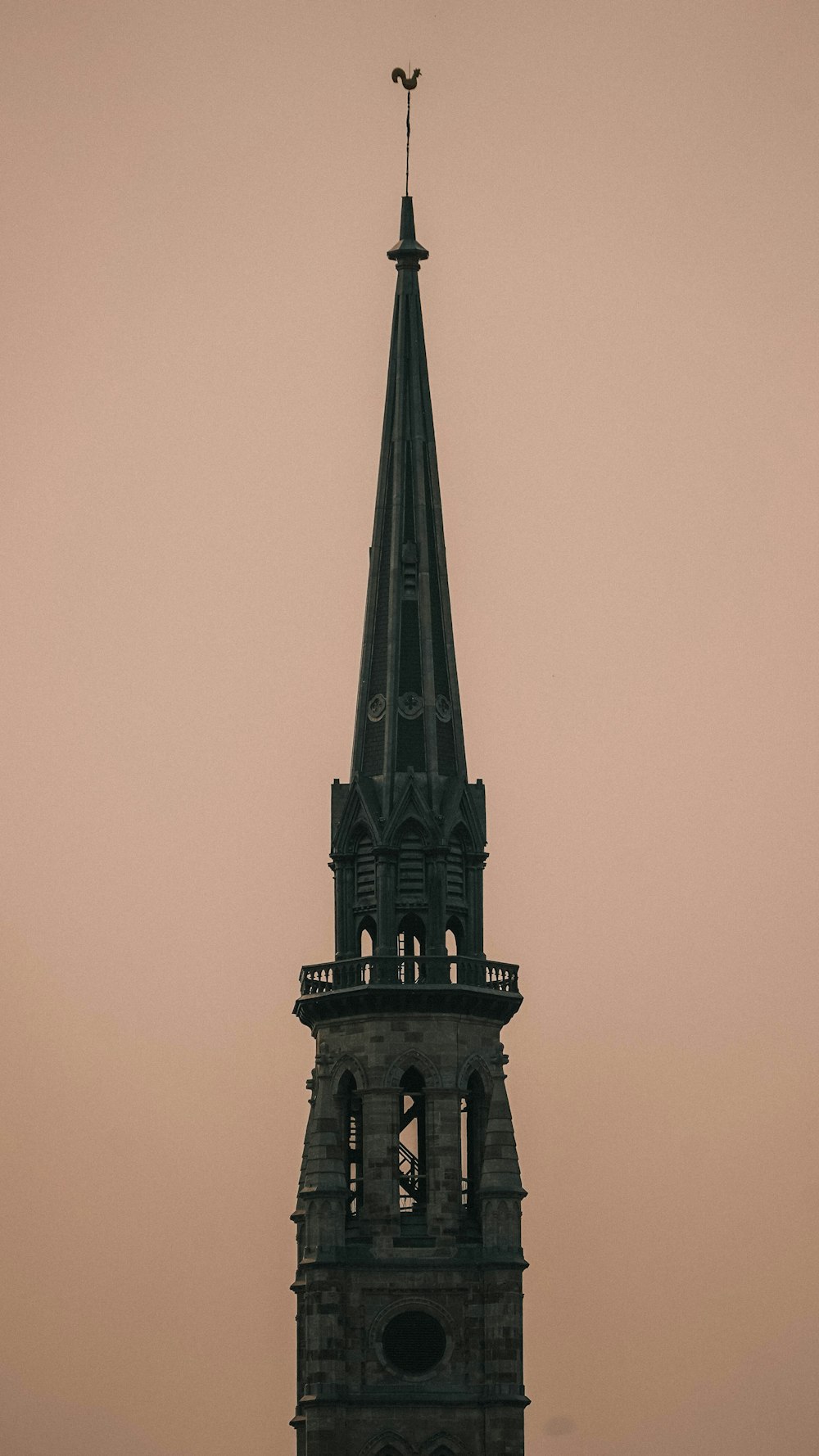 a tall tower with a clock on the top of it