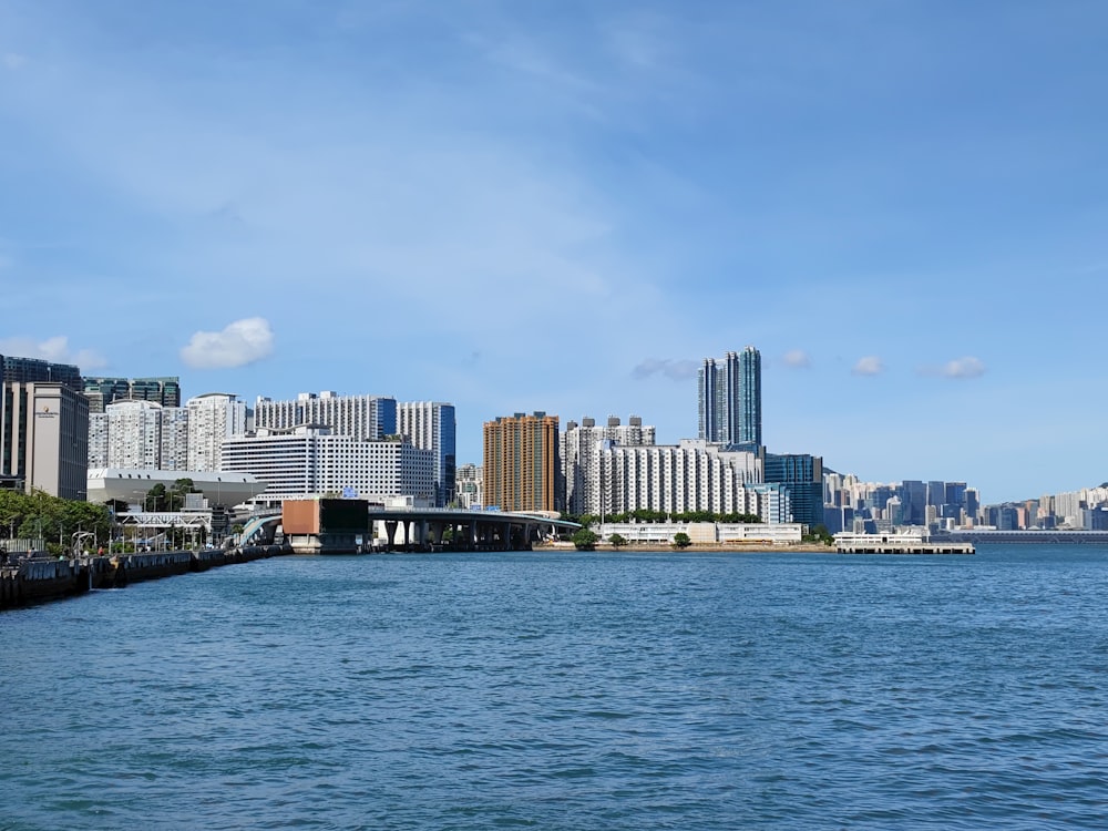 a body of water with a city in the background