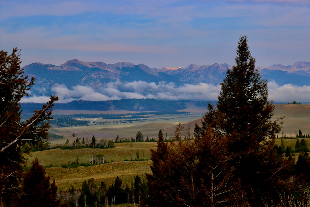 a view of the mountains and clouds from a distance