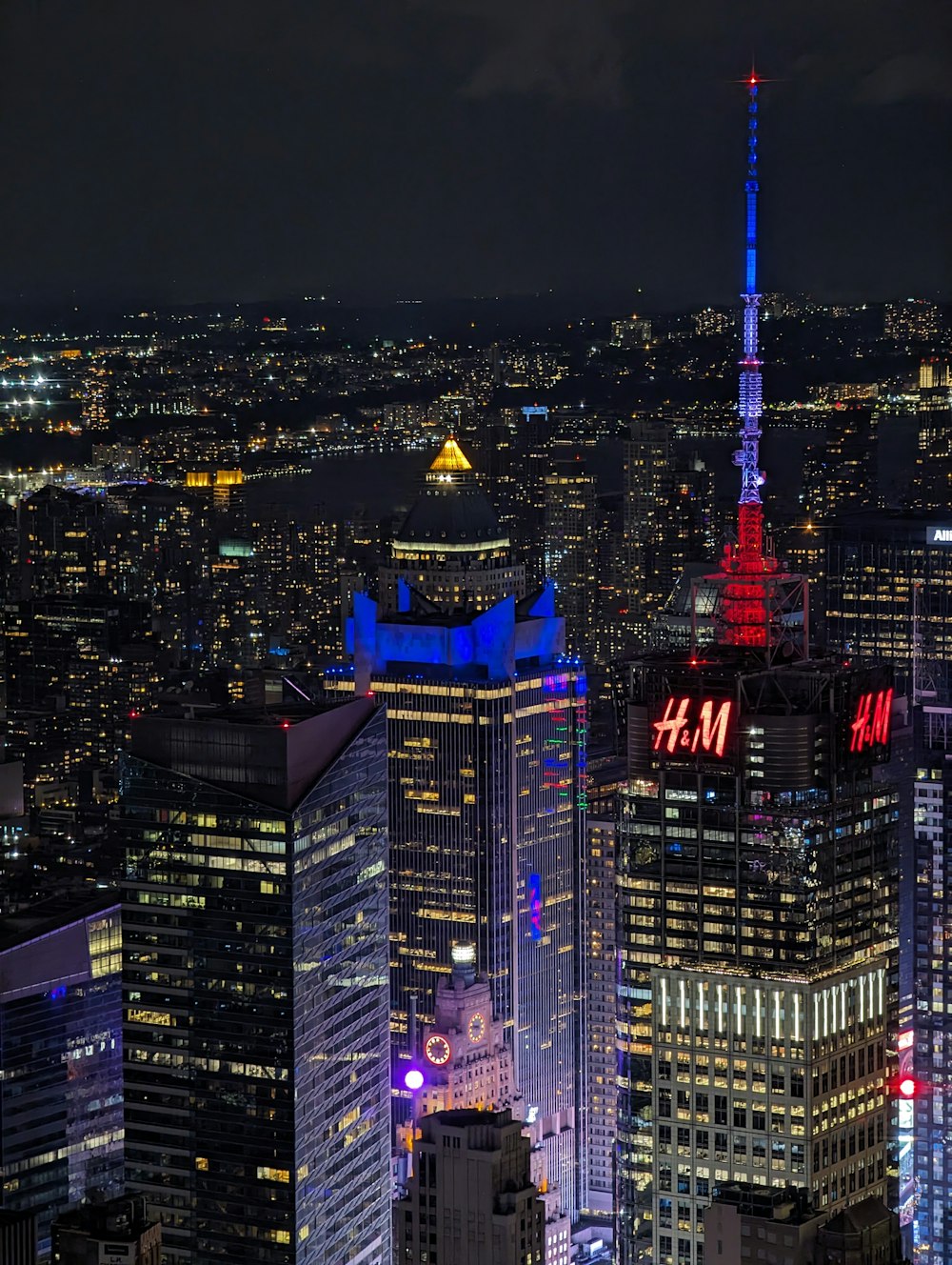 a view of a city at night from the top of a building