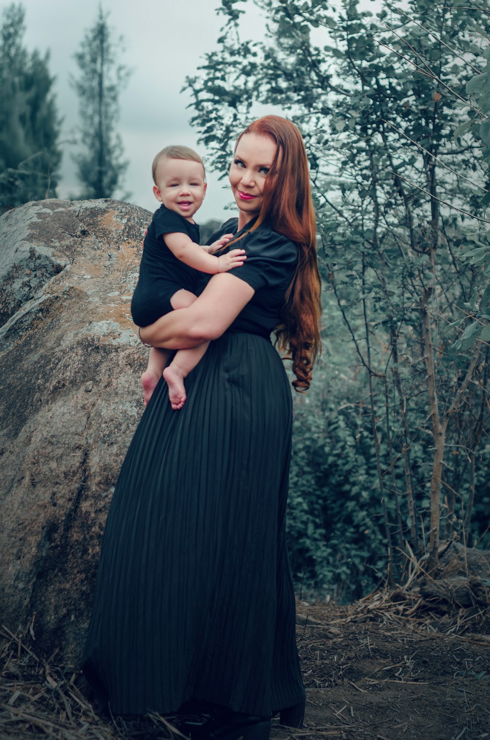 a woman holding a baby in her arms