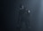 A humanoid robot with dark metallic body stands in a dimly lit environment, emitting an eerie presence. Its eyes glow white, providing a stark contrast to the dark surroundings. The robot's body is detailed with mechanical joints and a circular emblem on its shoulder.