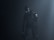 A humanoid robot with dark metallic body stands in a dimly lit environment, emitting an eerie presence. Its eyes glow white, providing a stark contrast to the dark surroundings. The robot's body is detailed with mechanical joints and a circular emblem on its shoulder.