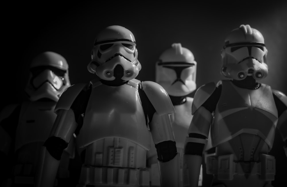 a group of star wars action figures standing next to each other