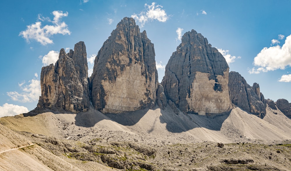 a group of mountains with a sky background