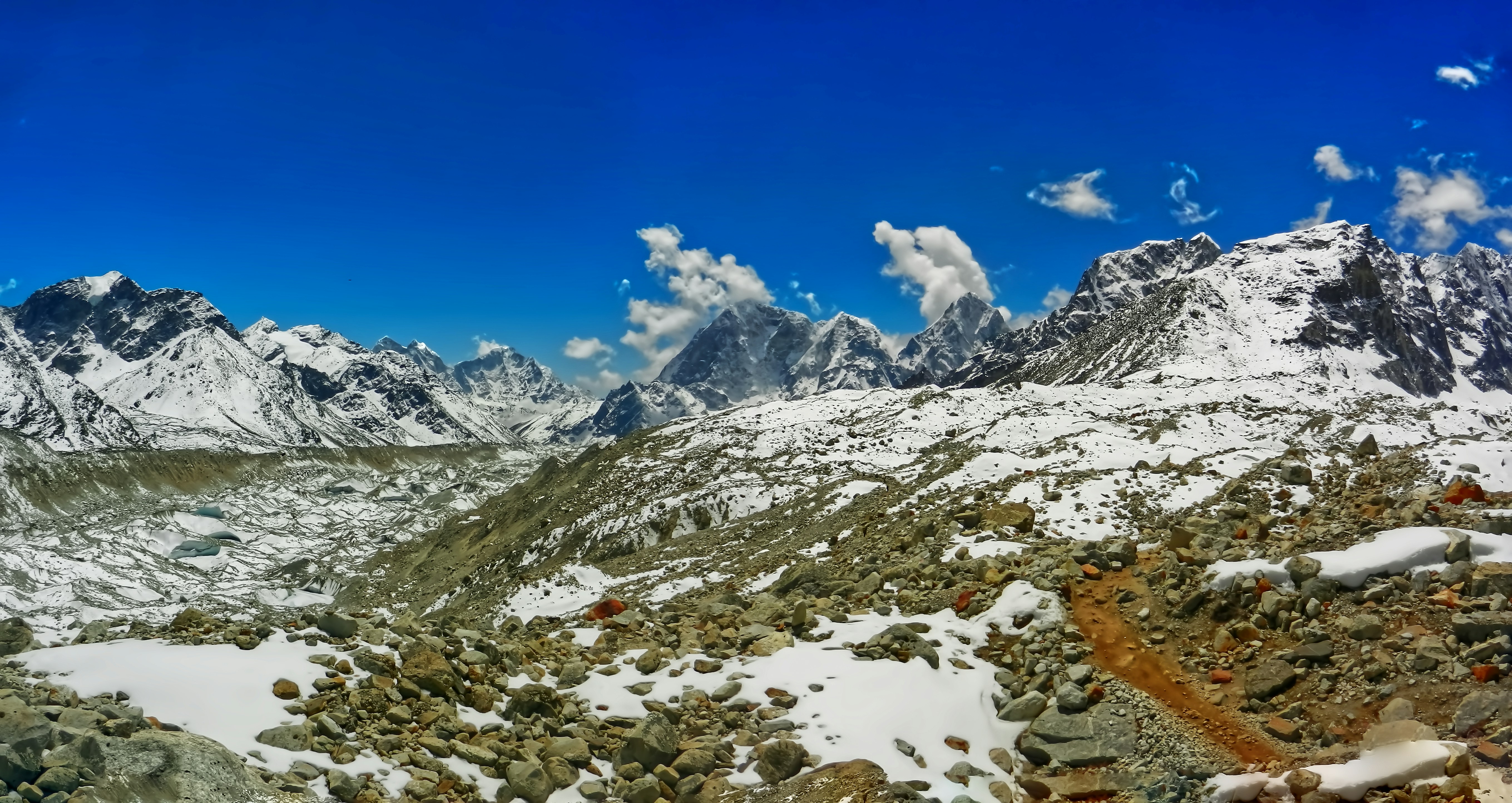 a view of a mountain range covered in snow