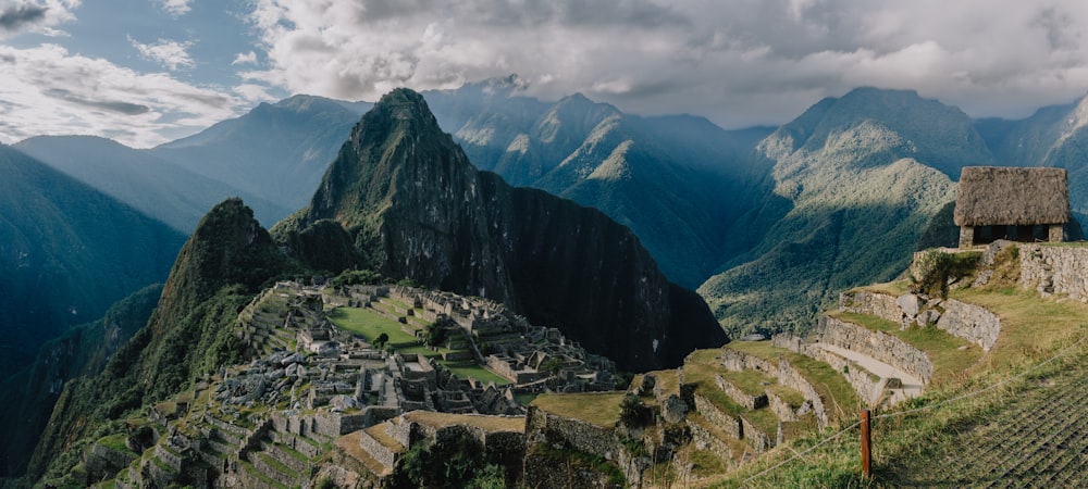 a view of a mountain range with a village in the foreground