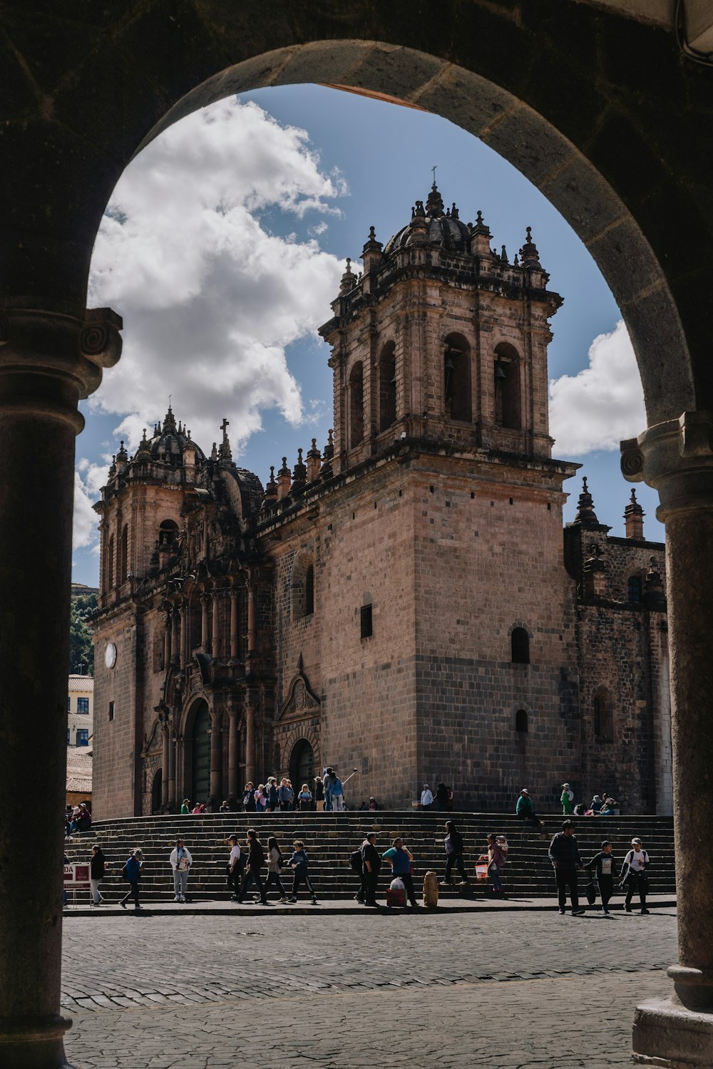 a group of people standing around a large building