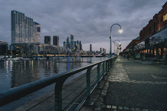 a view of a city at night from a bridge