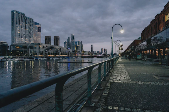 a view of a city at night from a bridge