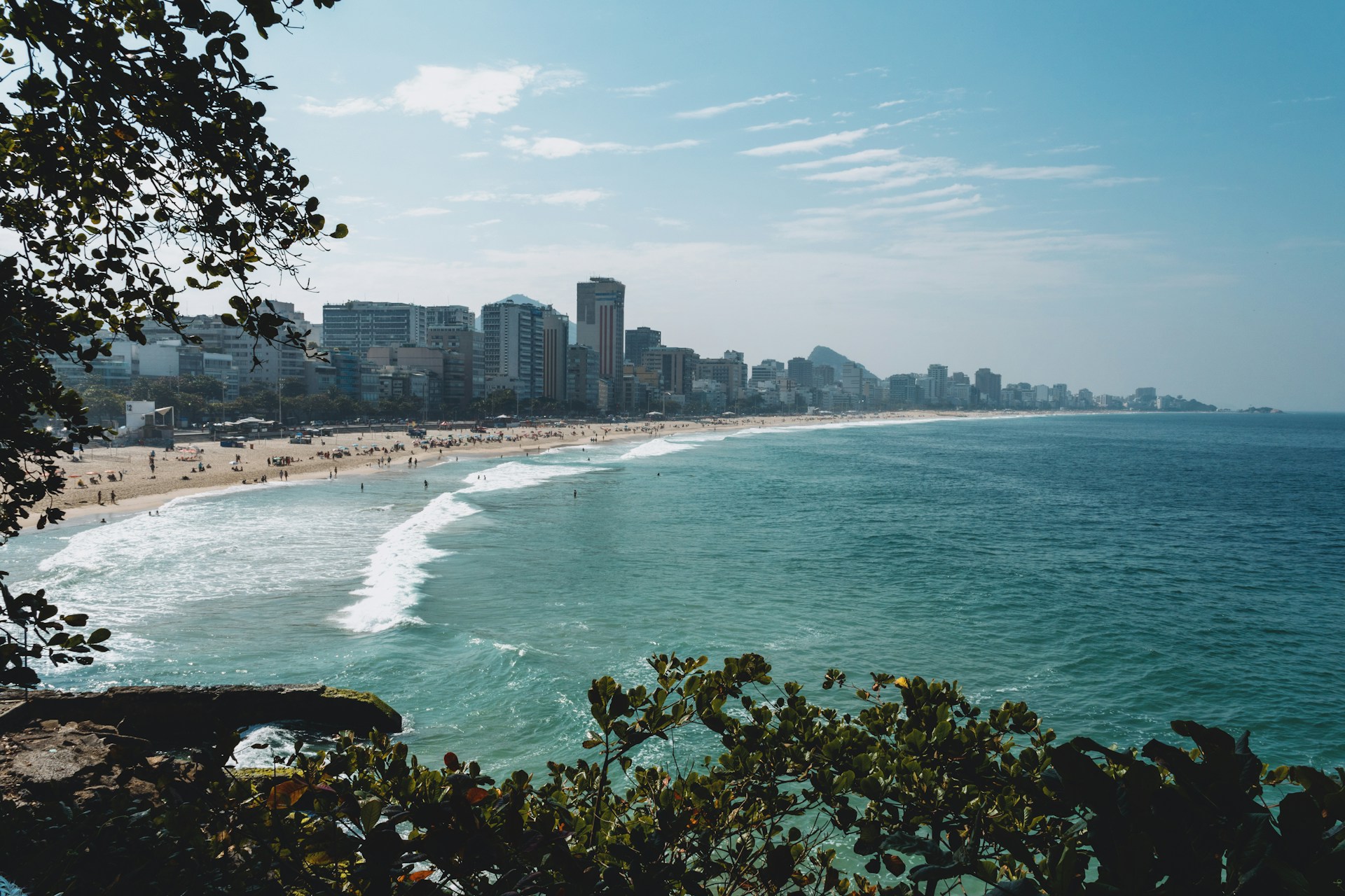 a view of a beach with a city in the background