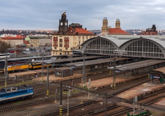 a train station with several trains on the tracks