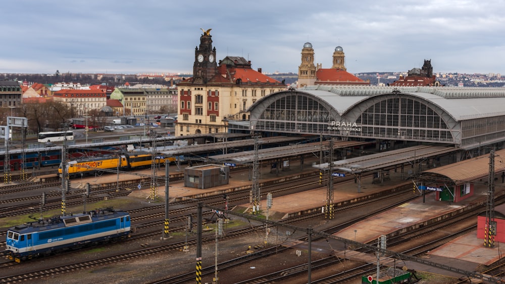 a train station with several trains on the tracks