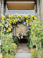 The parish hall’s new entrance with welcoming doors and a colorful flower bed.