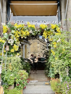 A warm and inviting school entrance with blooming flowers.