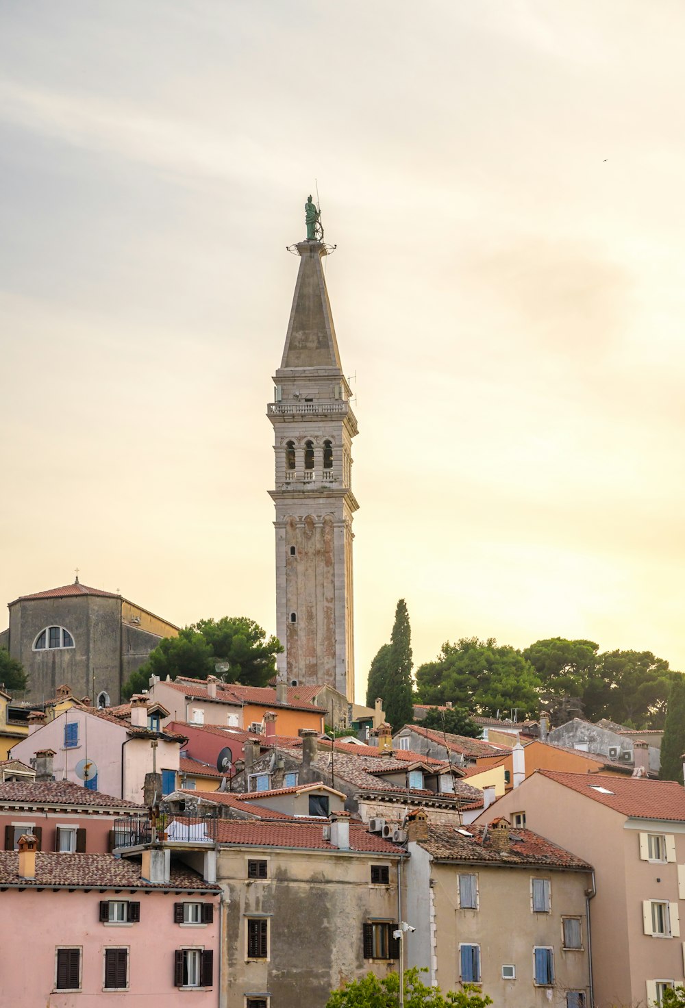 a tall clock tower towering over a city