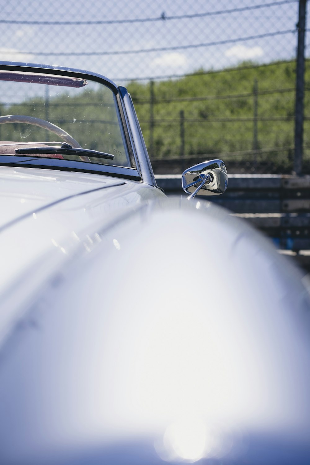 a close up of the front of a classic car