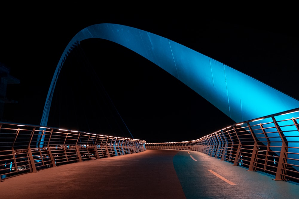 a bridge that is lit up at night