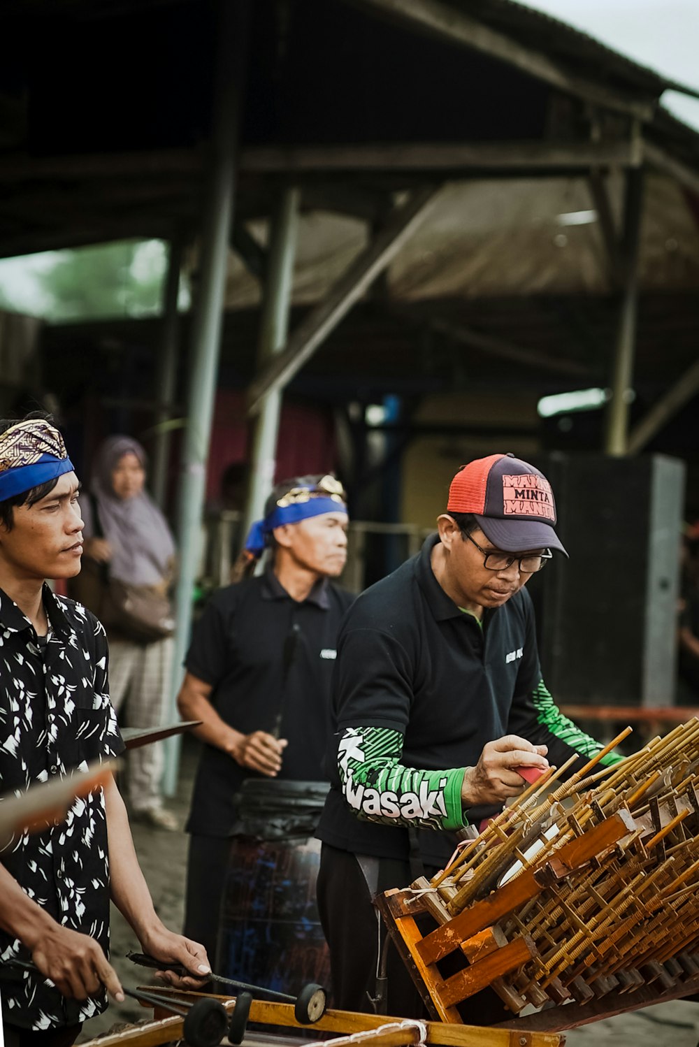 a group of men standing around a wooden crate