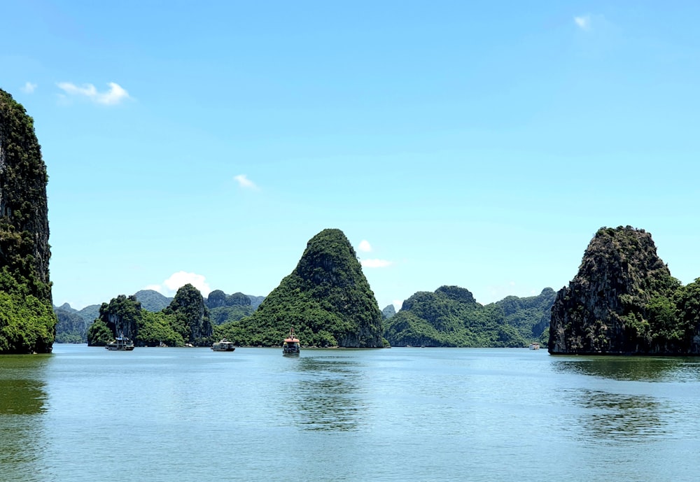 a body of water surrounded by mountains and trees