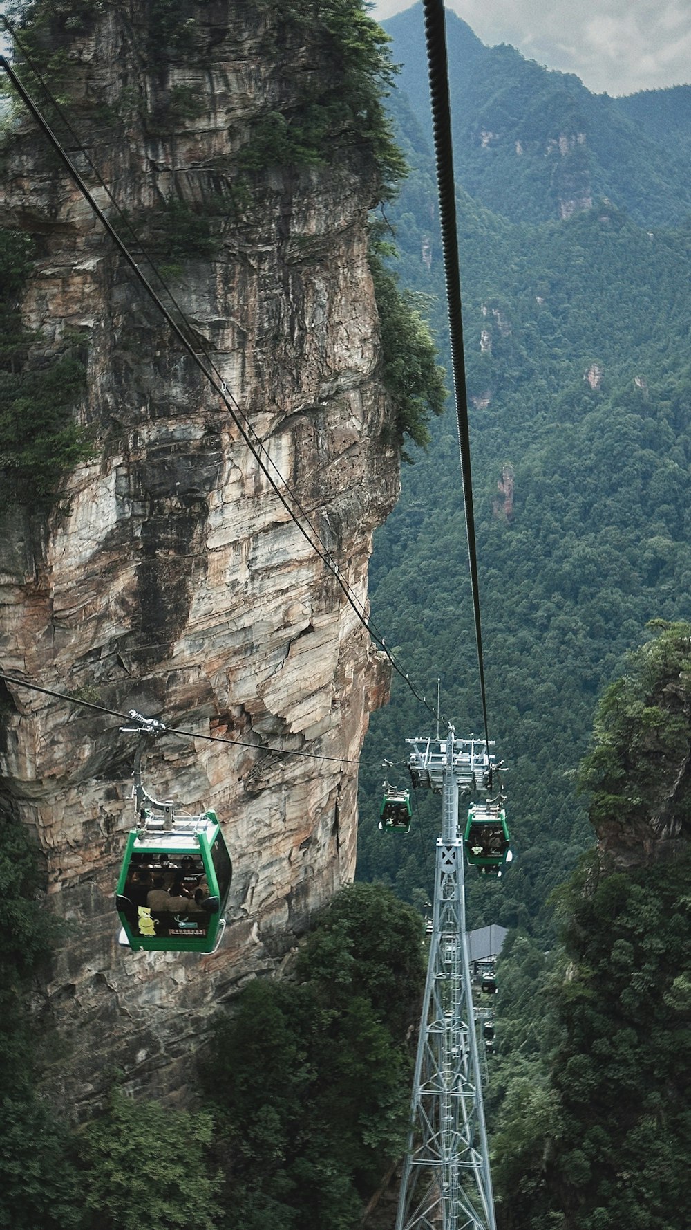 a cable car going up a mountain side