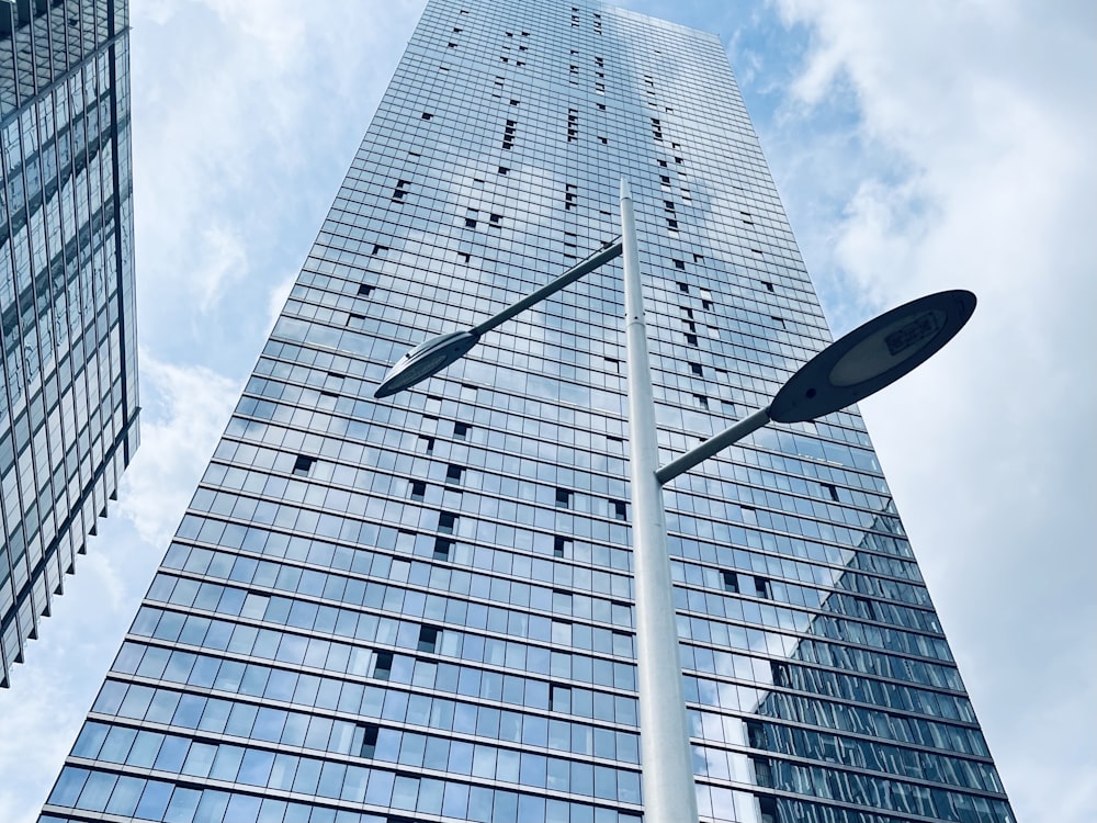 a street light in front of a tall building