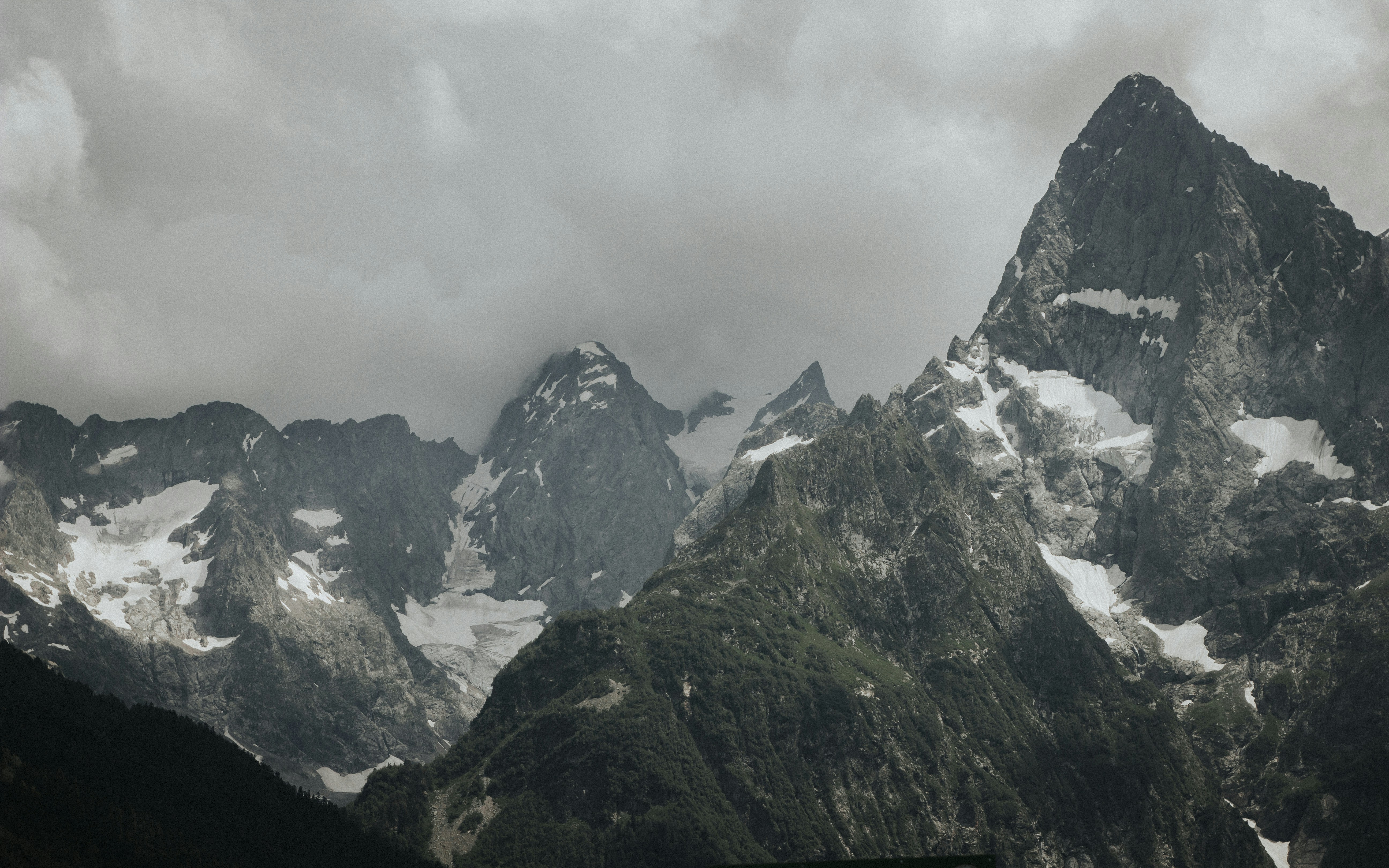 a very tall mountain with snow on it