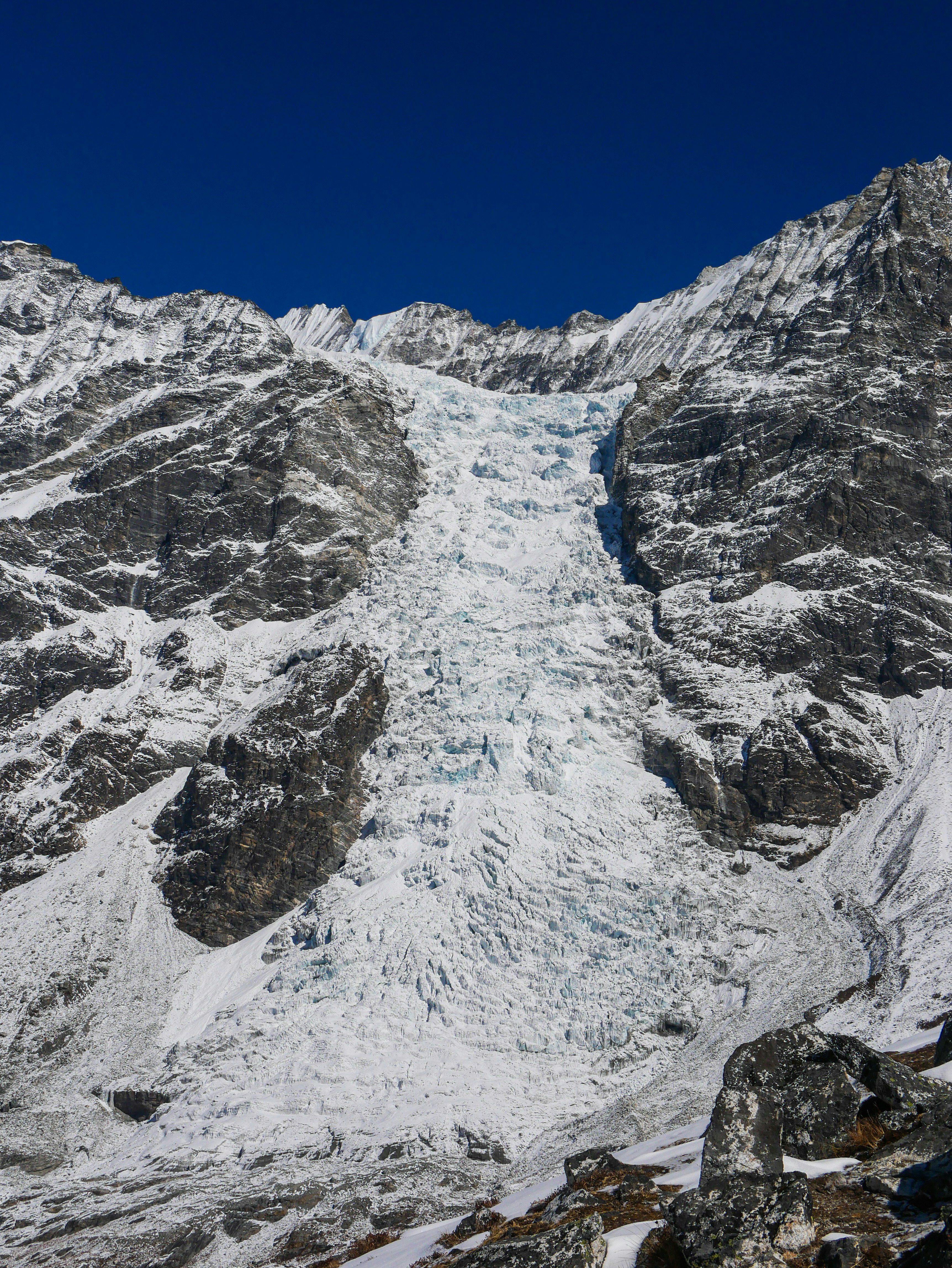 a very tall mountain covered in lots of snow