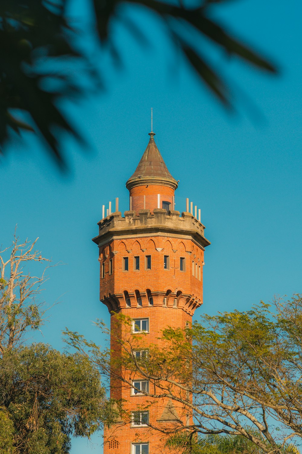 a tall tower with a clock on the top of it