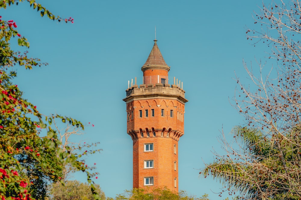 a tall tower with a clock on the top of it