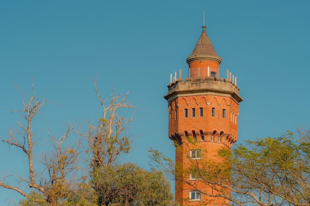 a tall tower with a clock on the top of it