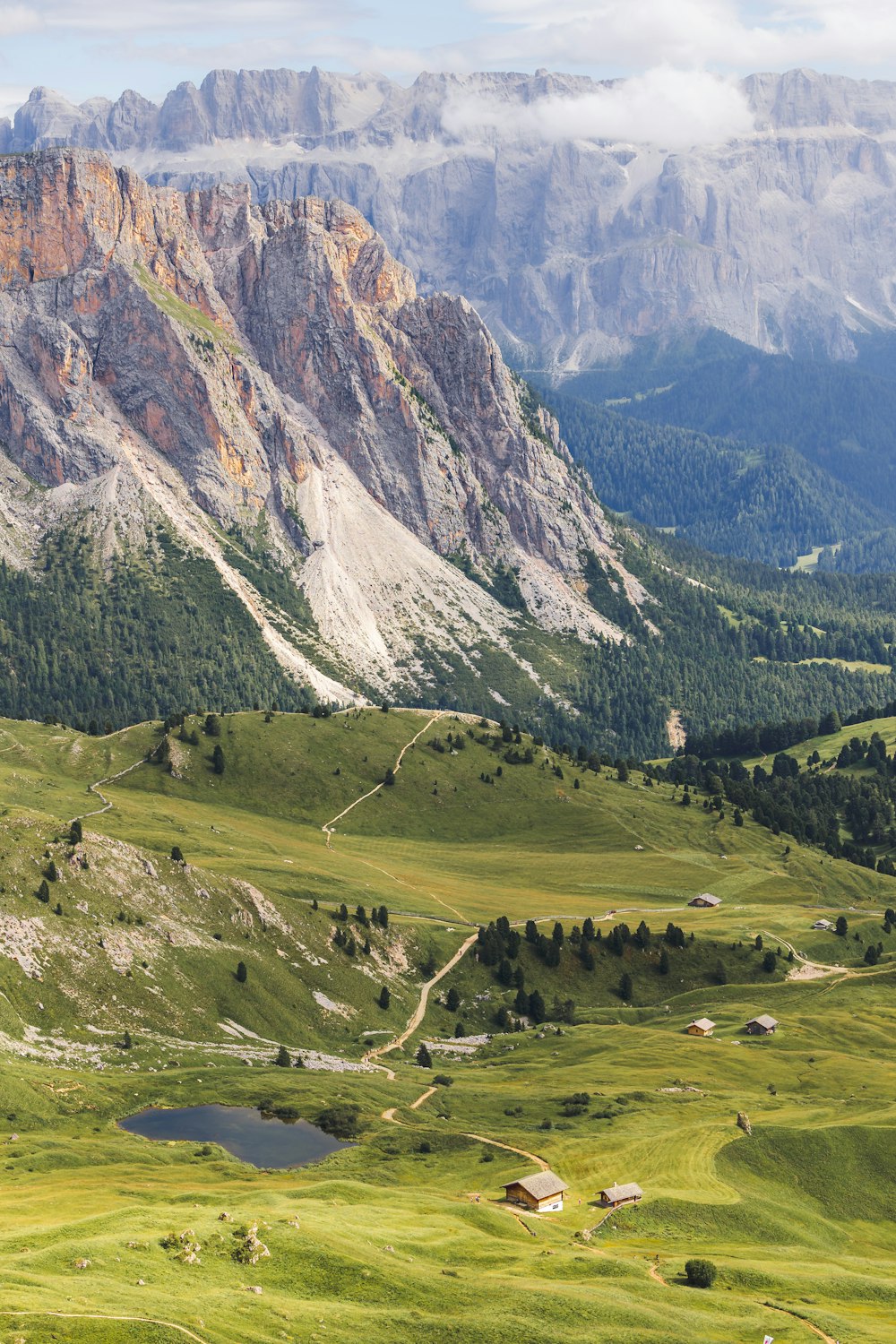 a view of a valley with mountains in the background