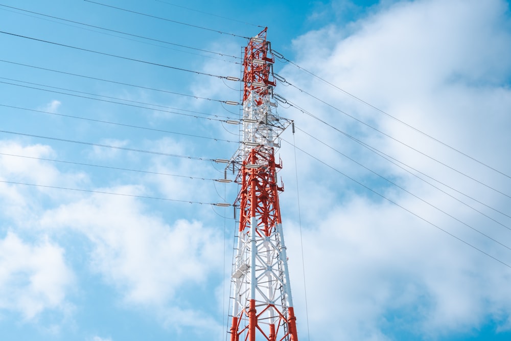 a red and white tower on a clear day